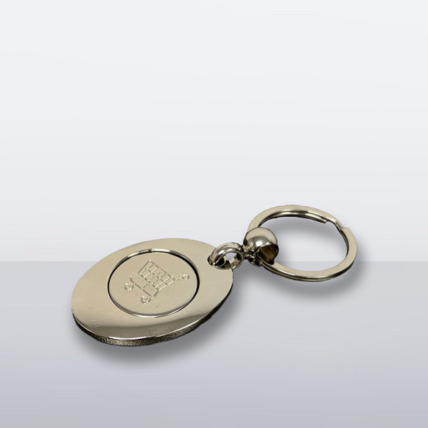 Schlüsselanhänger mit integriertem Einkaufschip und Einkaufswagensymbol auf der Rückseite