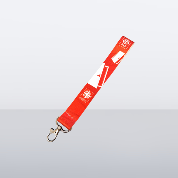 Rotes Schlüsselband mit SkF- und Caritas-Logo und Karabinerhaken